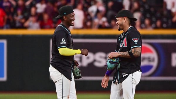 Arizona Diamondbacks infielders Geraldo Perdomo (left) and Ketel Marte  celebrate a win at Chase Field.