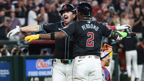 Arizona Diamondbacks outfielder Corbin Carroll (7) and shortstop Geraldo Perdomo (2) celebrate at home plate after scoring.