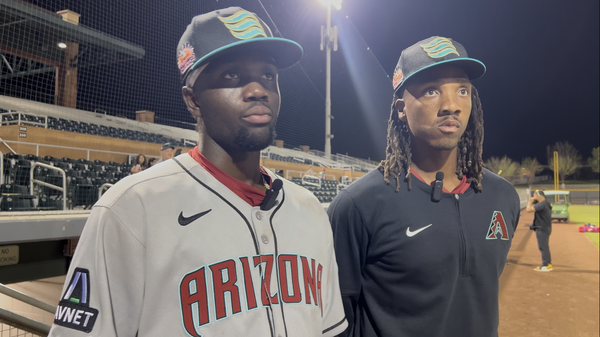 Arizona Diamondbacks infield prospect Jansel Luis (left) with Salt River Pitching Coach Tyler Mark (right) at Scottsdale Stadium.